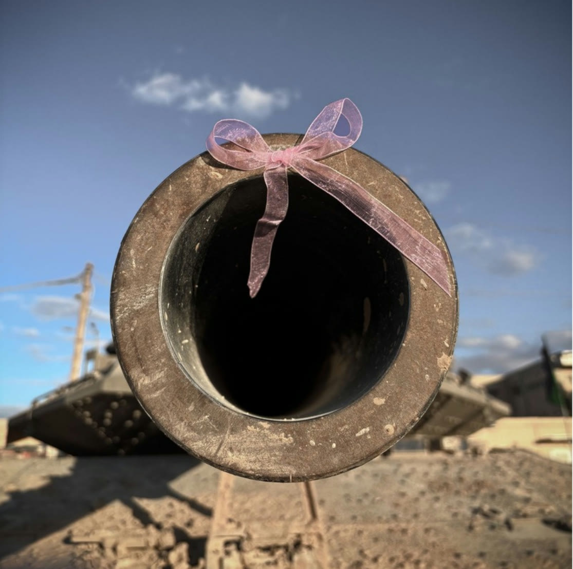 A tank barrel tied with a pink ribbon
